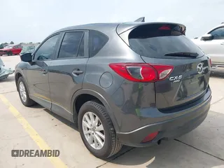 2016 Mazda CX-5 Sport with VIN JM3KE4BY8G0921243, listed as a IAAI auction lot 42102663 with 111,960 mi miles and . Bid and sale history available at DreamBid. Image 3.