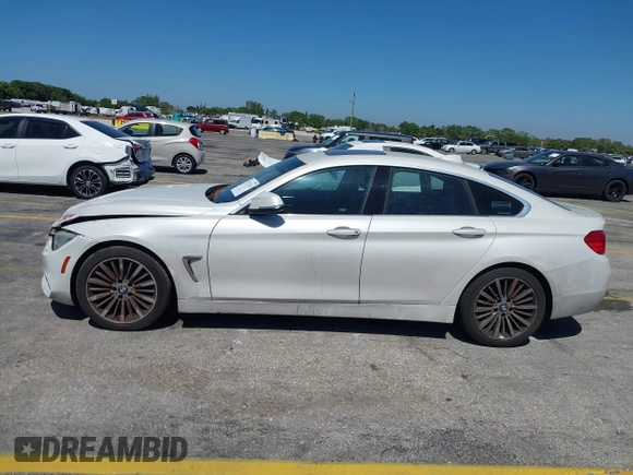 2015 BMW 4 Series 428i with VIN WBA4A5C58FGK15335, listed as a IAAI auction lot 41723243 with 152,652 mi miles and . Bid and sale history available at DreamBid. Image 13.