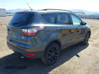 2017 Ford Escape SE with VIN 1FMCU9G94HUE80554, listed as a IAAI auction lot 42039491 with 57,145 mi miles. Bid and sale history available at carsss.com. Image 4.