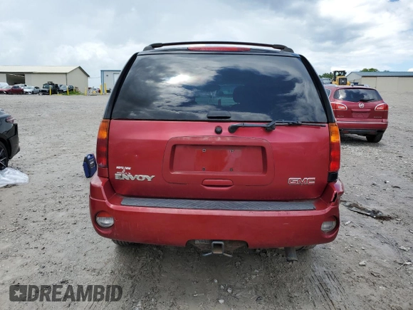 2005 GMC Envoy SLE z VIN 1GKDT13S752203494, wystawiony jako Copart lot #56150605 z przebiegiem 243 475 mil mil oraz Szkody całkowita. Historia ofert i sprzedaży dostępna na DreamBid. Obrazek 6.