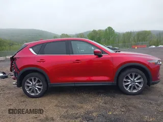 2020 Mazda CX-5 Grand Touring with VIN JM3KFBDM7L1731837, listed as a IAAI auction lot 42160795 with 63,826 mi miles and . Bid and sale history available at DreamBid. Image 14.