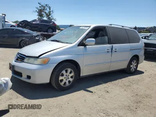 2003 Honda Odyssey EX-L with VIN 5FNRL18913B115140, listed as a Copart auction lot 64523025 with 137,182 mi miles and Salvage title. Bid and sale history available at DreamBid. Image 1.