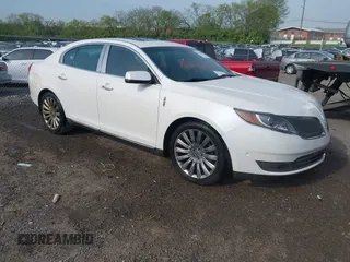2013 Lincoln MKS with VIN 1LNHL9DK4DG611684, listed as a IAAI auction lot 42043879 with 132,866 mi miles. Bid and sale history available at carsss.com. Image 1.