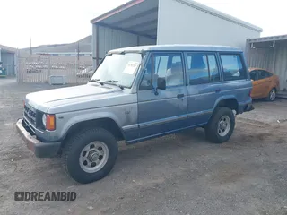 1991 Mitsubishi Montero z VIN JA4GJ31S0MJ006906, wystawiony jako IAAI lot #41782268 z przebiegiem 184 605 mil mil oraz . Historia ofert i sprzedaży dostępna na DreamBid. Obrazek 2.