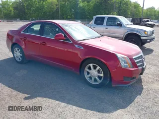 2009 Cadillac CTS AWD w/1SB with VIN 1G6DS57V490128140, listed as a IAAI auction lot 42001773 with 95,597 mi miles. Bid and sale history available at carsss.com. Image 1.