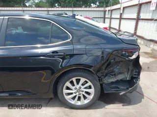 2023 Toyota Camry LE z VIN 4T1C11AK3PU182887, wystawiony jako IAAI lot #42156807 z przebiegiem 33 019 mil mil oraz . Historia ofert i sprzedaży dostępna na DreamBid. Obrazek 6.