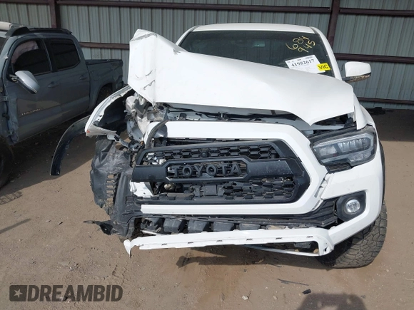 2021 Toyota Tacoma SR z VIN 3TMCZ5AN4MM373247, wystawiony jako IAAI lot #41982617 z przebiegiem 45 692 mil mil oraz . Historia ofert i sprzedaży dostępna na DreamBid. Obrazek 6.