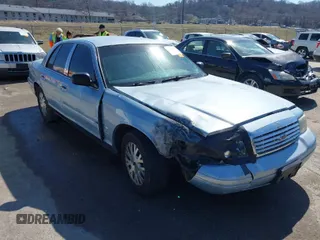 2003 Ford Crown Victoria LX z VIN 2FAHP74W03X180565, wystawiony jako IAAI lot #41728386 z przebiegiem 189 394 mil mil oraz . Historia ofert i sprzedaży dostępna na DreamBid. Obrazek 1.