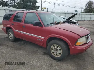 1999 GMC Jimmy SLE with VIN 1GKDT13W3X2546163, listed as a Copart auction lot 79842734 with 144,800 mi miles and Salvage Title. Bid and sale history available at carsss.com. Image 4.