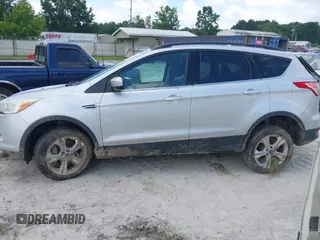 2014 Ford Escape SE with VIN 1FMCU9G9XEUD91390, listed as a IAAI auction lot 42561849 with 319,400 mi miles and . Bid and sale history available at DreamBid. Image 15.