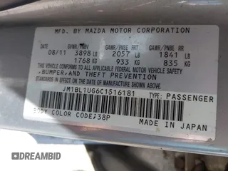 2012 Mazda Mazda3 i Sport with VIN JM1BL1UG6C1516181, listed as a IAAI auction lot 42130825 with 140,868 mi miles. Bid and sale history available at carsss.com. Image 9.