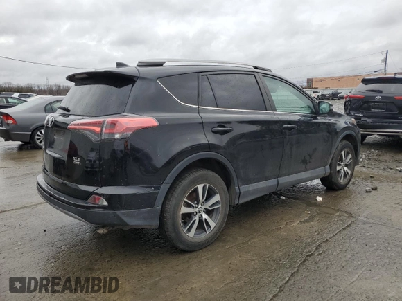 2018 Toyota RAV4 XLE with VIN 2T3RFREVXJW723057, listed as a Copart auction lot 49176705 with 5,980 mi miles and Salvage Title. Bid and sale history available at DreamBid. Image 3.