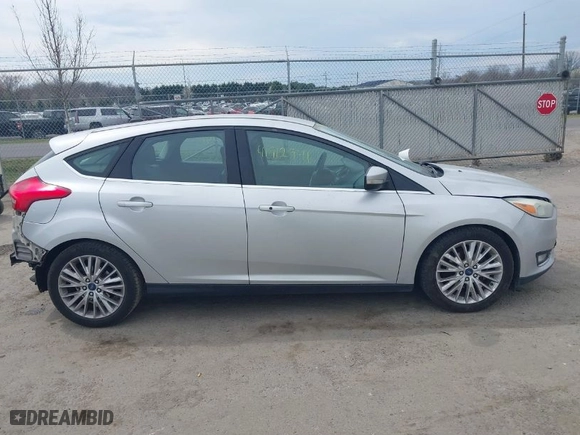 2015 Ford Focus Titanium with VIN 1FADP3N27FL228549, listed as a IAAI auction lot 41912941 with 69,025 mi miles. Bid and sale history available at carsss.com. Image 13.