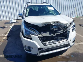 2022 Subaru Forester Touring with VIN JF2SKARC9NH445126, listed as a IAAI auction lot 42350111 with 61,998 mi miles and . Bid and sale history available at DreamBid. Image 6.