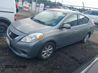 2014 Nissan Versa SV with VIN 3N1CN7APXEL862867, listed as a IAAI auction lot 42447084 with 202,413 mi miles and . Bid and sale history available at DreamBid. Image 2.