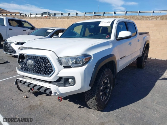 2019 Toyota Tacoma 4WD SR5 with VIN 3TMDZ5BN1KM079305, listed as a IAAI auction lot 41247804 with 98,494 mi miles. Bid and sale history available at carsss.com. Image 2.