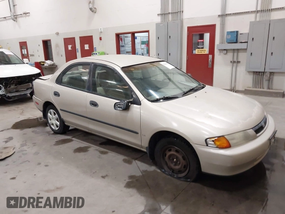 1998 Mazda Protege DX z VIN JM1BC1419W0171802, wystawiony jako IAAI lot #42202861 z przebiegiem 252 304 mil mil oraz . Historia ofert i sprzedaży dostępna na DreamBid. Obrazek 1.