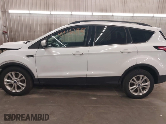 2018 Ford Escape SE z VIN 1FMCU9GD2JUB17518, wystawiony jako IAAI lot #41919245 z przebiegiem 102 626 mil mil oraz . Historia ofert i sprzedaży dostępna na DreamBid. Obrazek 15.