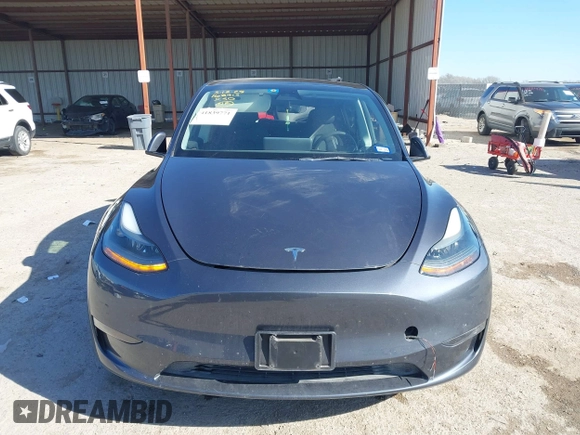 2023 Tesla Model Y Long Range with VIN 7SAYGAEE8PF667728, listed as a IAAI auction lot 41839771 with 32,654 mi miles and . Bid and sale history available at DreamBid. Image 12.
