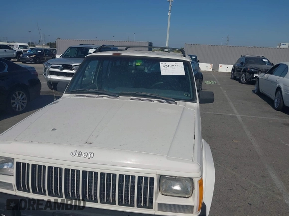 1996 Jeep Cherokee Sport with VIN 1J4FT68S7TL265733, listed as a IAAI auction lot 42499228 with 230,001 mi miles and . Bid and sale history available at DreamBid. Image 6.