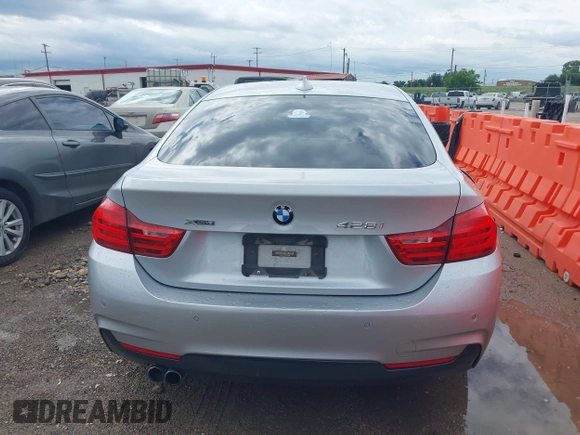 2015 BMW 4 Series 428i xDrive with VIN WBA4C9C50FD330482, listed as a IAAI auction lot 42116547 with 192,739 mi miles and . Bid and sale history available at DreamBid. Image 16.