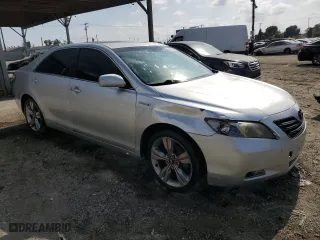 2007 Toyota Camry Hybrid with VIN JTNBB46K073036990, listed as a Copart auction lot 54250035 with 198,952 mi miles and Clean Title. Bid and sale history available at carsss.com. Image 4.