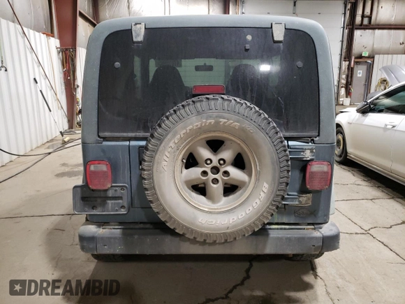 1999 Jeep Wrangler SE with VIN 1J4FY29P0XP412753, listed as a Copart auction lot 47015985 with 137,388 mi miles and Salvage Title. Bid and sale history available at carsss.com. Image 6.