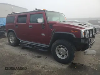 2003 Hummer H2 with VIN 5GRGN23UX3H147490, listed as a Copart auction lot 82876424 with 241,737 mi miles and Clean Title. Bid and sale history available at carsss.com. Image 4.