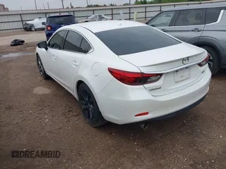 2016 Mazda 6 i Grand Touring with VIN JM1GJ1W54G1429179, listed as a IAAI auction lot 42117223 with 142,319 mi miles and . Bid and sale history available at DreamBid. Image 3.