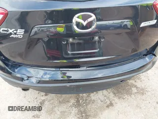 2013 Mazda CX-5 Grand Touring with VIN JM3KE4DE6D0148030, listed as a IAAI auction lot 42082947 with 119,432 mi miles and . Bid and sale history available at DreamBid. Image 6.