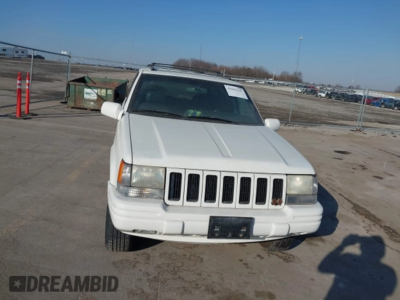 1997 Jeep Grand Cherokee Limited with VIN 1J4GZ78Y8VC769675, listed as a IAAI auction lot 41694347 with 113,834 mi miles. Bid and sale history available at carsss.com. Image 6.