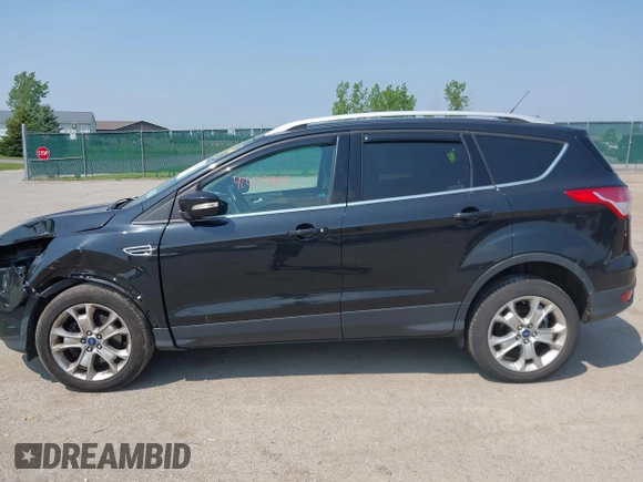 2015 Ford Escape Titanium with VIN 1FMCU9J96FUB58519, listed as a IAAI auction lot 42429369 with 125,541 mi miles and . Bid and sale history available at DreamBid. Image 14.
