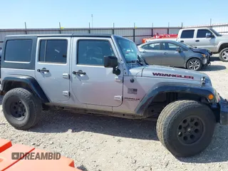 2015 Jeep Wrangler Unlimited Sport z VIN 1C4BJWDG0FL745533, wystawiony jako IAAI lot #41844126 z przebiegiem 151 620 mil mil oraz . Historia ofert i sprzedaży dostępna na DreamBid. Obrazek 14.