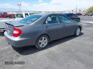 2003 Toyota Camry LE with VIN JTDBE32K130149032, listed as a IAAI auction lot 42063174 with 241,424 mi miles and . Bid and sale history available at DreamBid. Image 4.