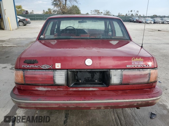 1990 Pontiac Bonneville z VIN 1G2HX54C7L1244134, wystawiony jako Copart lot #77859884 z przebiegiem 104 905 mil mil oraz Czysty tytuł • Clean title. Historia ofert i sprzedaży dostępna na DreamBid. Obrazek 6.