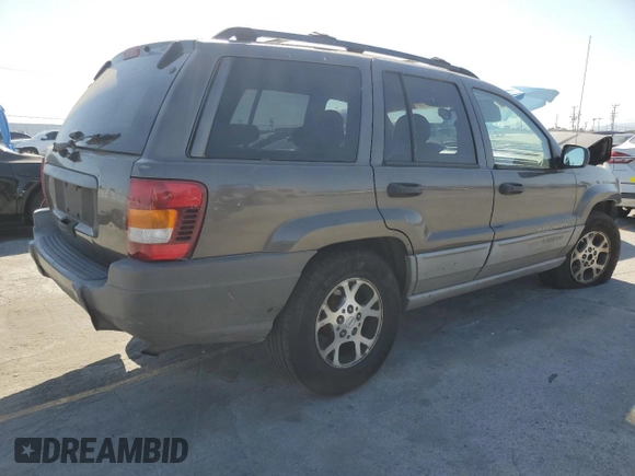 2000 Jeep Grand Cherokee Laredo with VIN 1J4G248S2YC377133, listed as a Copart auction lot 57916785 with 217,525 mi miles and Salvage title. Bid and sale history available at DreamBid. Image 3.