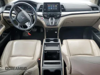 2020 Honda Odyssey Touring with VIN 5FNRL6H8XLB019365, listed as a Copart auction lot 52404335 with 59,486 mi miles and Salvage Title. Bid and sale history available at DreamBid. Image 8.