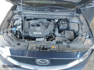 2021 Mazda CX-5 Grand Touring Reserve with VIN JM3KFBAY7M0466156, listed as a IAAI auction lot 41931407 with 55,136 mi miles. Bid and sale history available at carsss.com. Image 10.