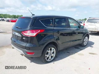 2013 Ford Escape SEL with VIN 1FMCU9HX1DUB97939, listed as a IAAI auction lot 42293561 with 196,951 mi miles and . Bid and sale history available at DreamBid. Image 4.