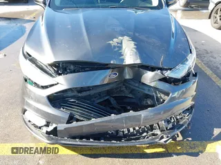 2018 Ford Fusion SE z VIN 3FA6P0H70JR191384, wystawiony jako IAAI lot #41340319 z przebiegiem 89 581 mil mil oraz . Historia ofert i sprzedaży dostępna na DreamBid. Obrazek 6.