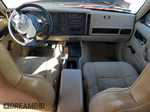 1995 Jeep Cherokee Sport with VIN 1J4FJ68S2SL666126, listed as a Copart auction lot 50496735 with 158,523 mi miles and Salvage title. Bid and sale history available at DreamBid. Image 8.