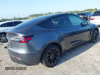 2023 Tesla Model Y Long Range z VIN 7SAYGDEE5PA099226, wystawiony jako IAAI lot #42004061 z przebiegiem 10 607 mil mil oraz . Historia ofert i sprzedaży dostępna na DreamBid. Obrazek 4.