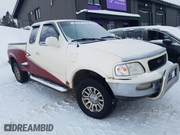1998 Ford F-150 XL with VIN 2FTRX08L2WCA75995, listed as a Copart auction lot 43717305 with 301,987 mi miles and Salvage title. Bid and sale history available at DreamBid. Image 4.