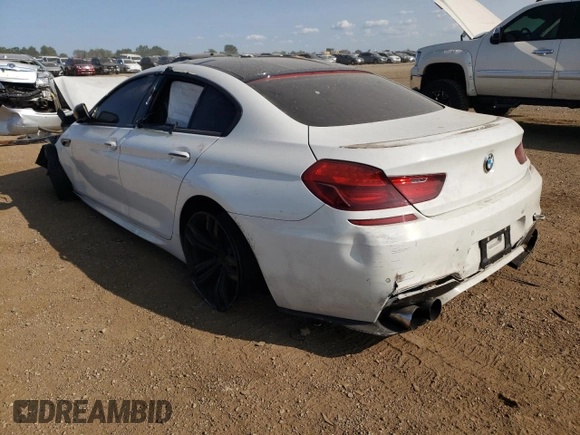 2015 BMW M6 z VIN WBS6C9C51FD467998, wystawiony jako Copart lot #67775934 z przebiegiem Nie podano mil oraz Szkody całkowita. Historia ofert i sprzedaży dostępna na DreamBid. Obrazek 2.