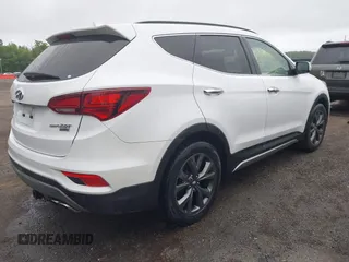 2018 Hyundai Santa Fe Ultimate with VIN 5NMZW4LA3JH088349, listed as a IAAI auction lot 42168983 with 66,884 mi miles and . Bid and sale history available at DreamBid. Image 4.