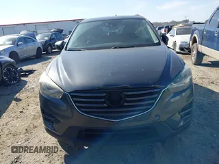2016 Mazda CX-5 Grand Touring with VIN JM3KE4DY8G0823567, listed as a IAAI auction lot 41784384 with 143,836 mi miles and . Bid and sale history available at carsss.com. Image 12.