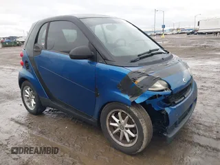 2009 Smart fortwo Pure with VIN WMEEJ31X79K304221, listed as a IAAI auction lot 41475774 with 127,304 mi miles. Bid and sale history available at carsss.com. Image 1.