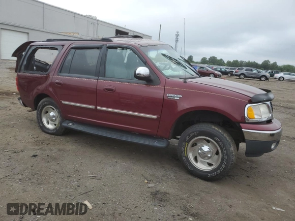 1999 Ford Expedition XLT with VIN 1FMPU18L6XLA61106, listed as a Copart auction lot 62688735 with 105,551 mi miles and Salvage title. Bid and sale history available at DreamBid. Image 4.