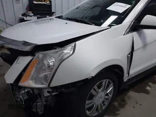 2014 Cadillac SRX Performance Collection with VIN 3GYFNFE36ES615440, listed as a IAAI auction lot 41830849 with 125,128 mi miles and . Bid and sale history available at DreamBid. Image 18.