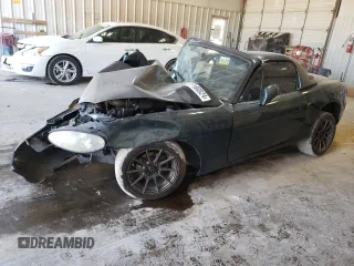 1999 Mazda MX-5 Miata z VIN JM1NB3535X0119791, wystawiony jako Copart lot #77180924 z przebiegiem Nie podano mil oraz Szkoda całkowita • Salvage title. Historia ofert i sprzedaży dostępna na DreamBid. Obrazek 1.